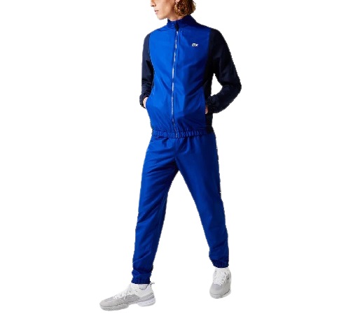 LACOSTE Survêtement color-block bleu. Style et fonctionnalité pour cet ensemble de survêtement Lacoste Sport conçu en taffetas léger. Il se compose d'une veste color-block signature et d'un pantalon orné de bandes latérales siglées.