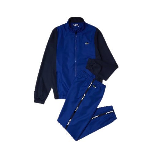 LACOSTE Survêtement color-block bleu. Style et fonctionnalité pour cet ensemble de survêtement Lacoste Sport conçu en taffetas léger. Il se compose d'une veste color-block signature et d'un pantalon orné de bandes latérales siglées.