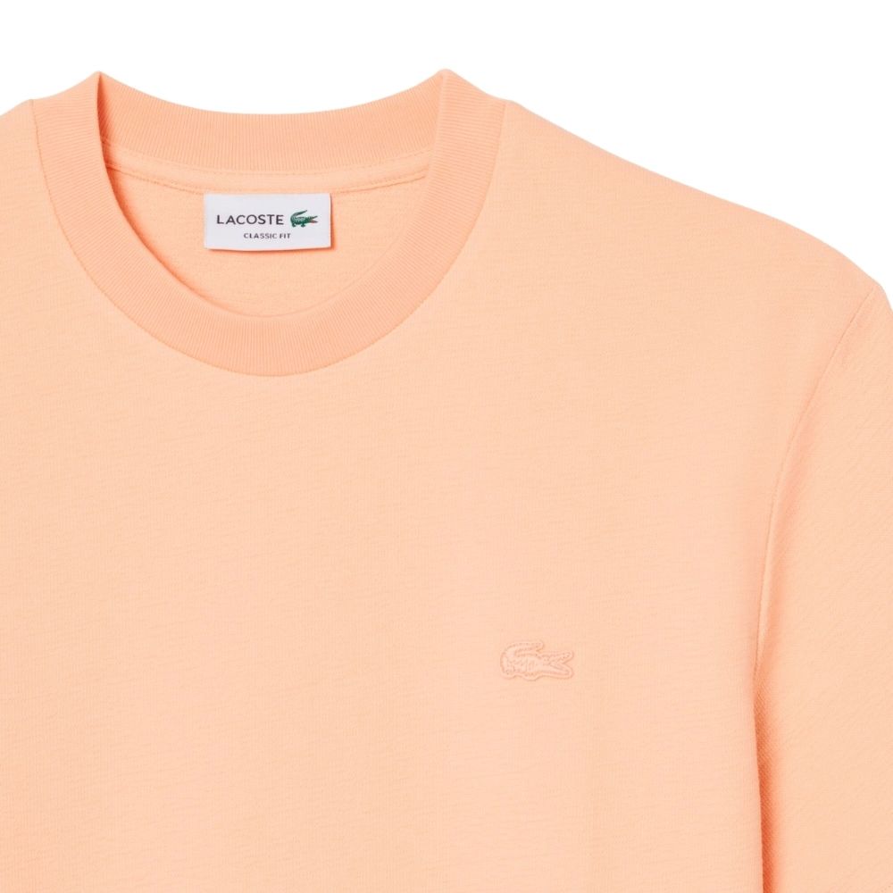 Découvrez ce nouveau t-shirt Lacoste jersey texturé pêche . chez sport aventure à Orange